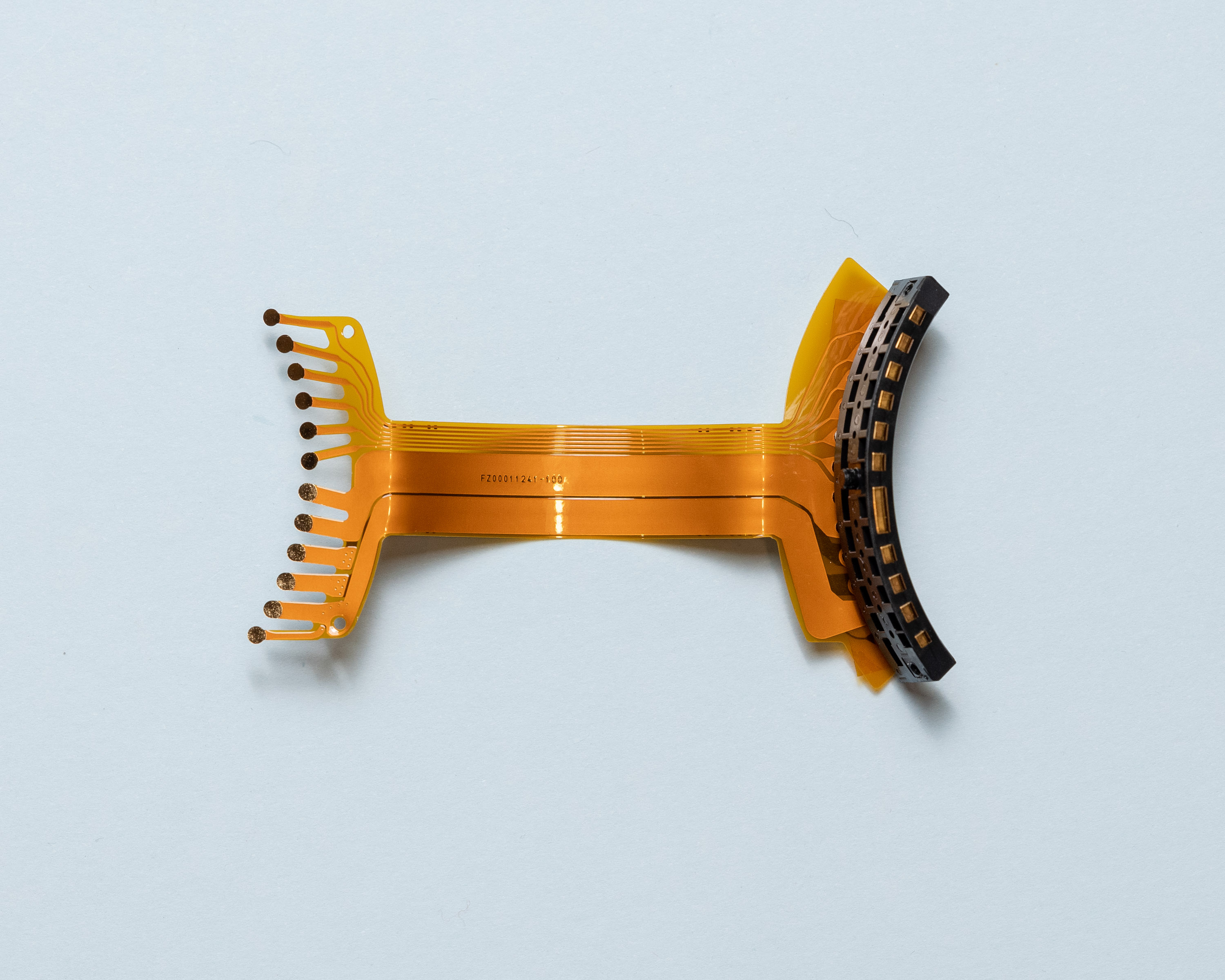 Back view of flex-PCB, two thick traces occupy 60% of visible surface area